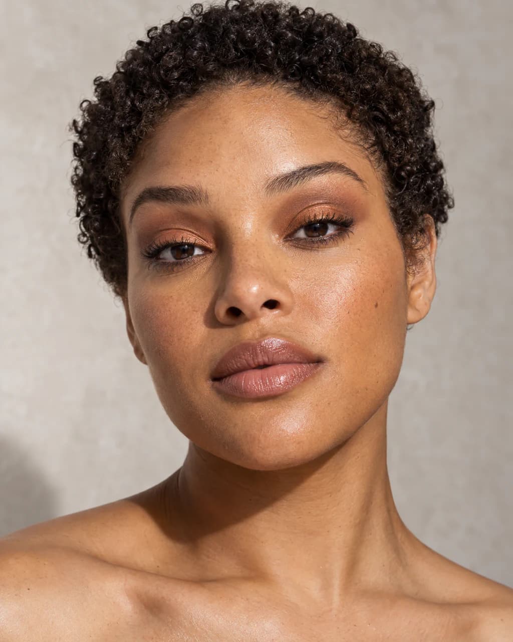 Synthetic adult sample portrait 2 showing a published makeup technique in neutral daylight.