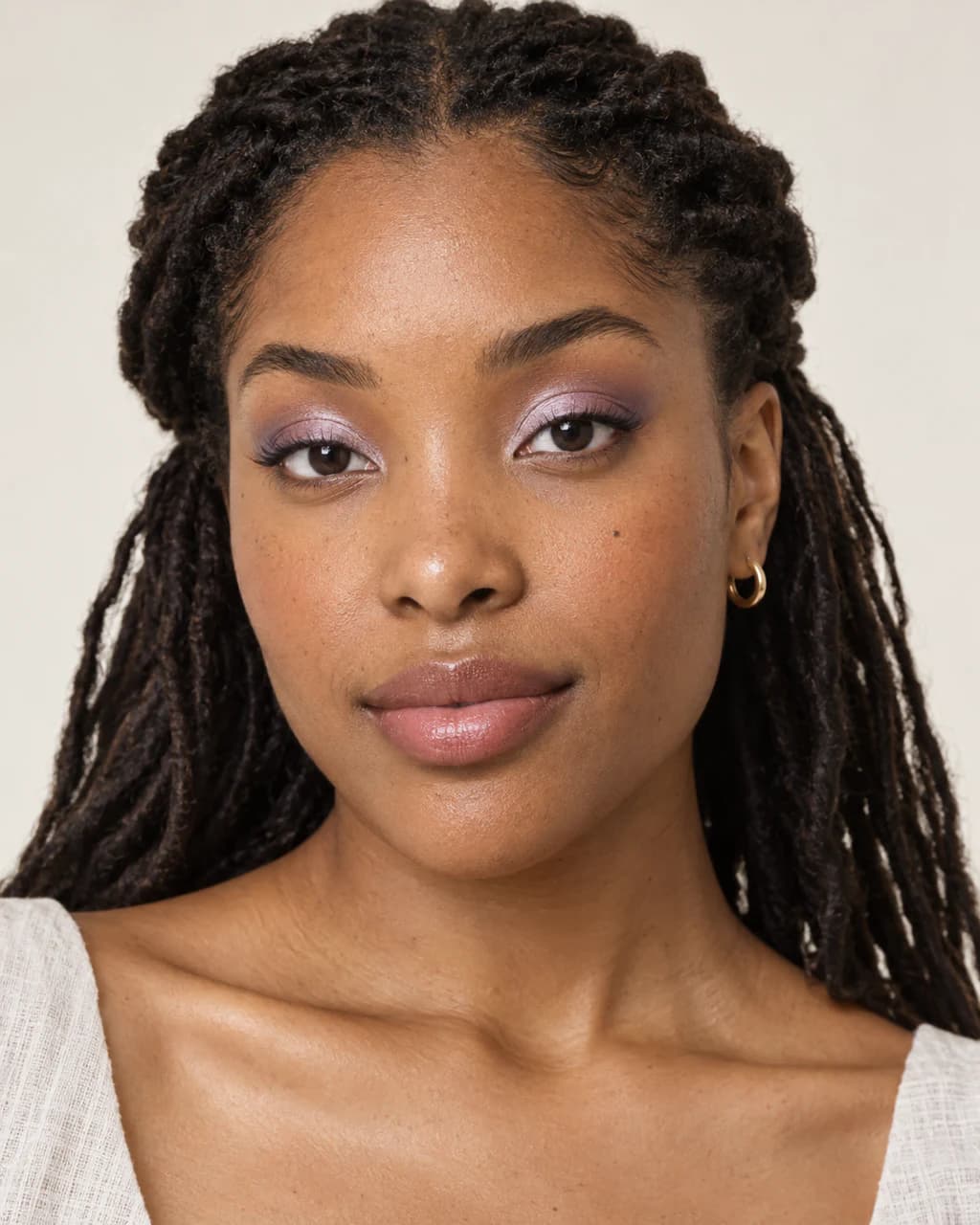Synthetic adult sample portrait 8 showing a published makeup technique in neutral daylight.